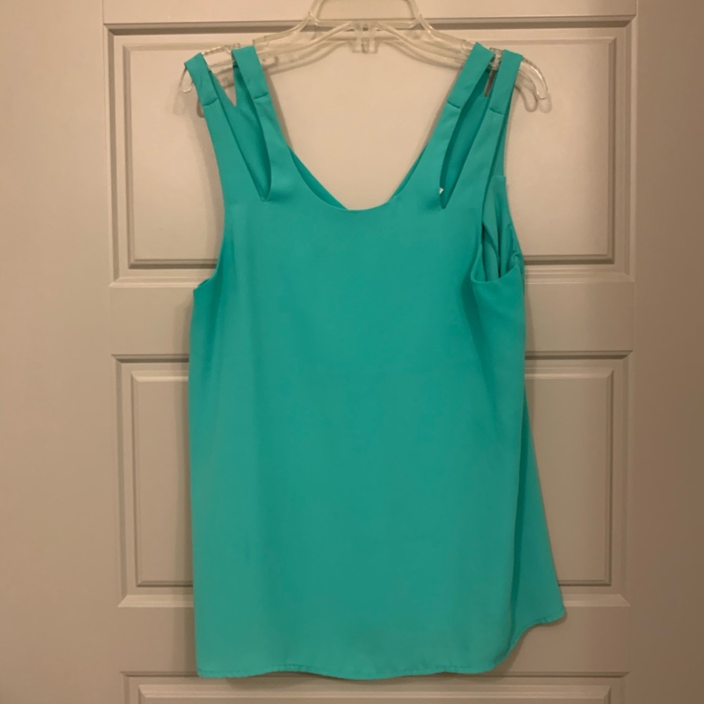 Green sleeveless blouse